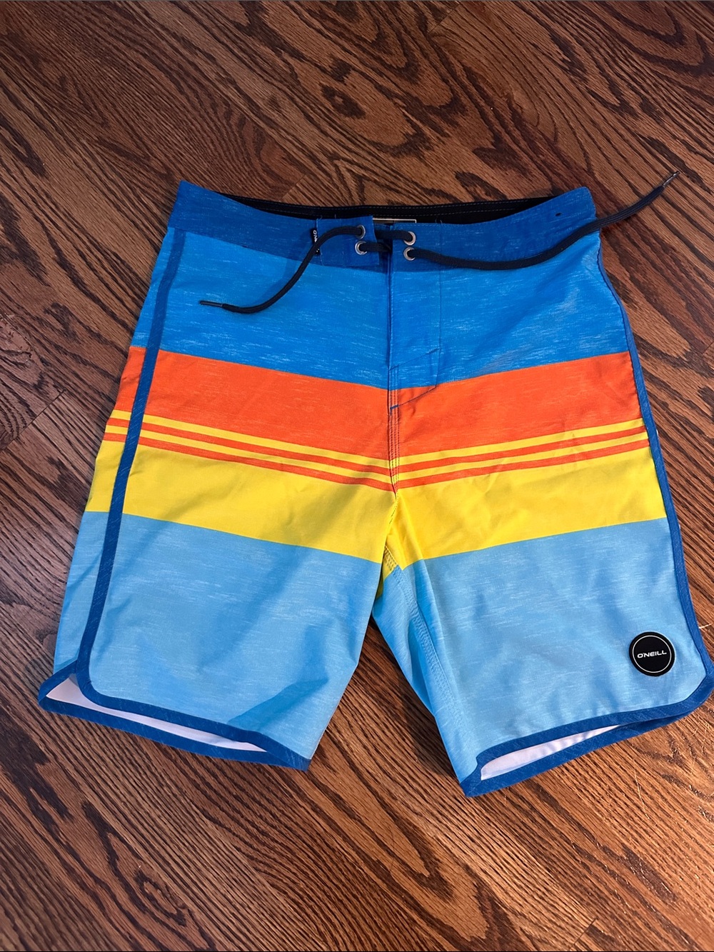 O'Neill Blue Boardshorts with Orange and Yellow Stripes
